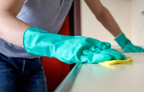 Technician treating stains on a sofa in a Bayswater apartment